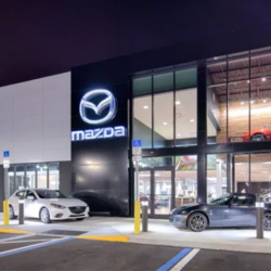 Mazda car dealership at night.